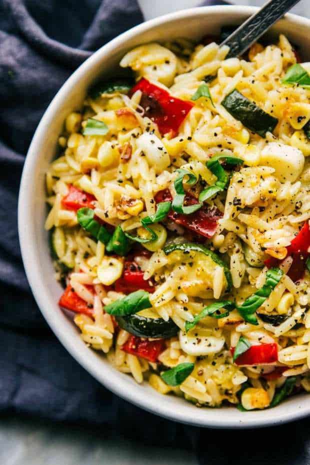 This orzo pasta salad is filled with fresh veggies and has a fresh lemon taste.  Perfect for your next potluck!