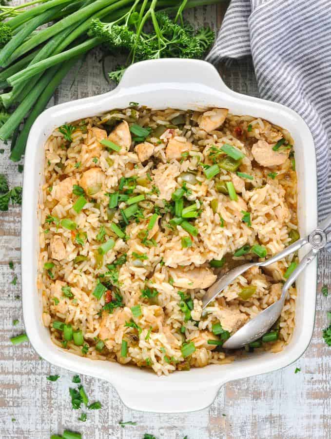 Add a bit of Cajun spice to your next weeknight dinner with this easy Dump-and-Bake Chicken and Dirty Rice!  The chicken, rice, and vegetables all cook together in one dish for a quick meal with just 10 minutes of prep!