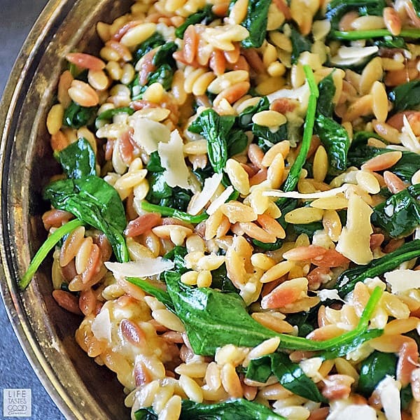 Orzo Pasta with Spinach and Parmesan is an easy recipe using fresh ingredients to maximize flavor. It makes an impressive side dish, but if you want an easy all-in-one meal, just add chicken for a delicious dinner that's quick and easy any night of the week.