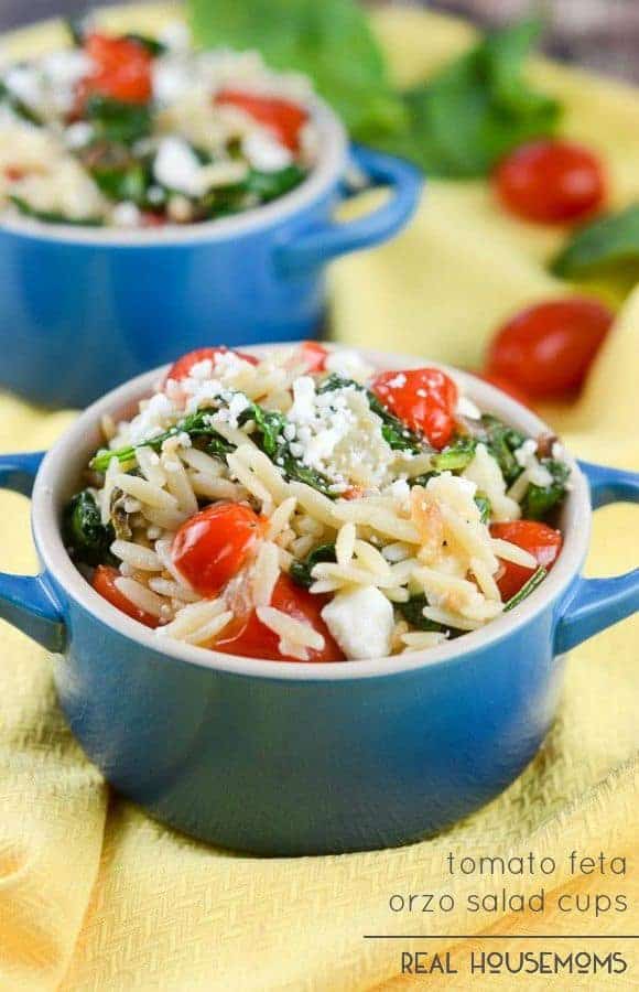 Tomato Feta Orzo Salad Cups are cups with orzo pasta with tomatoes, spinach, garlic, and feta cheese dressed in an Italian vinaigrette. It makes a wonderful pasta salad with a Mediterranean flair.