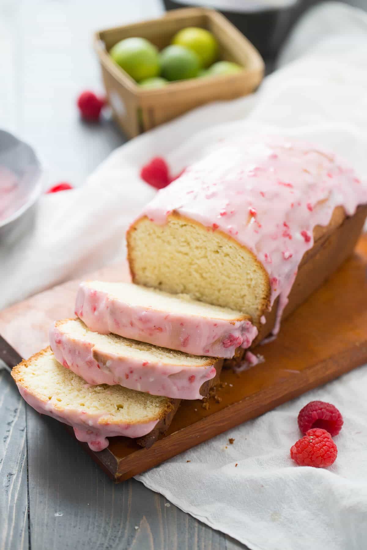 Raspberry Glazed Key Lime Cake is amazing! This pound cake loaf is a tangy key lime cake that is drizzled with a sweet, homemade raspberry glaze.  Everything about this easy cake screams happiness!
