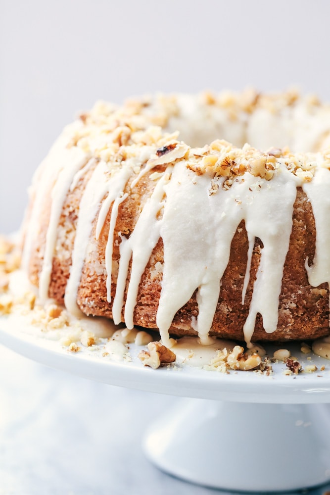 Glazed Walnut Butter Cake is a perfectly moist and tender buttery cake filled with walnuts and made with ingredients you already have on hand.  This cake gets a delicious glaze and is topped with chopped walnuts and will become a new favorite!