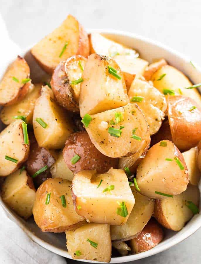 These Crock Pot Garlic Ranch Potatoes are bursting with garlic and ranch flavor! Perfect for any easy weeknight side dish, or to save some room on your stove when you have company.  One of my all time favorite slow cooker potato recipes!