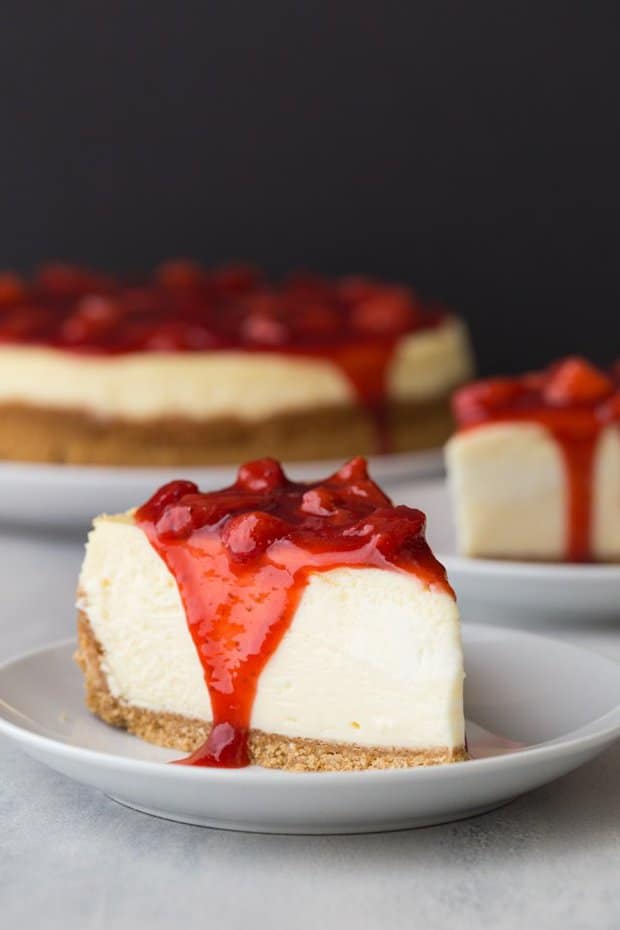 Strawberry Cheesecake features a creamy cheesecake on a graham cracker crust topped with fresh strawberry sauce.