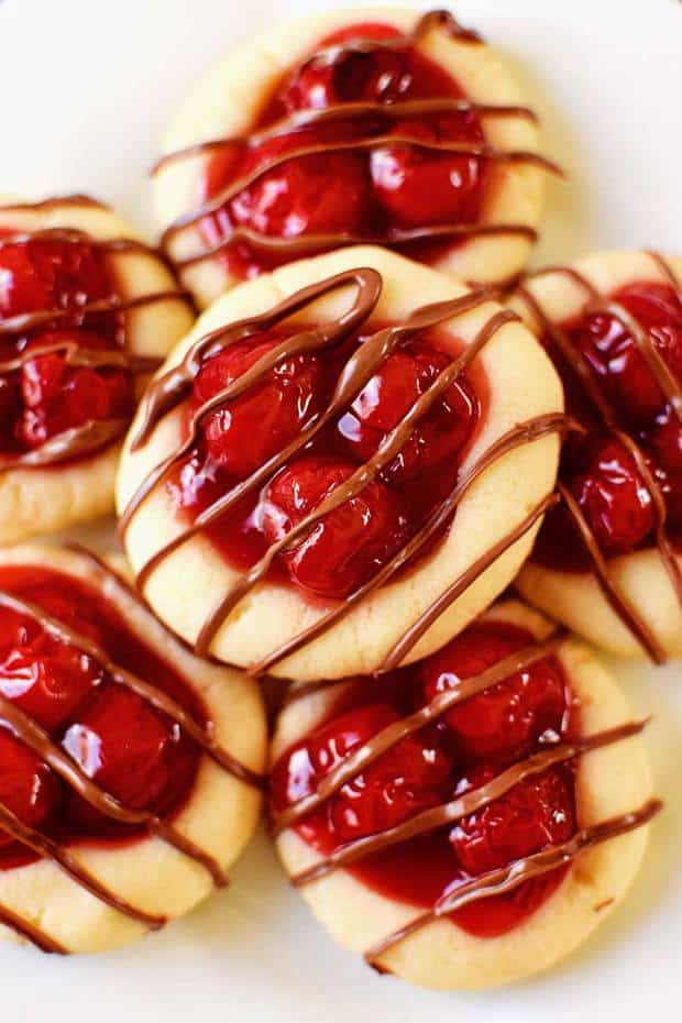 The taste of cherry pie without all the fuss! Cherry pie filling nestled in a buttery cookie and drizzled with milk chocolate. Festive and delicious!
