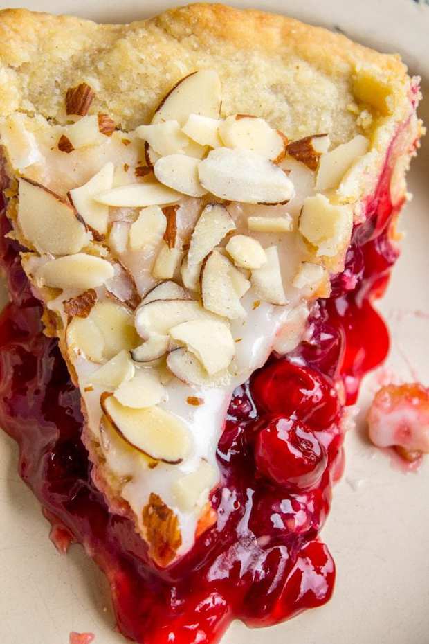 This Cranberry Cherry Pie is just what you need for Thanksgiving! It's has perfect pops of tart from of the cranberries. The almond glaze on the top adds the perfect crunch!