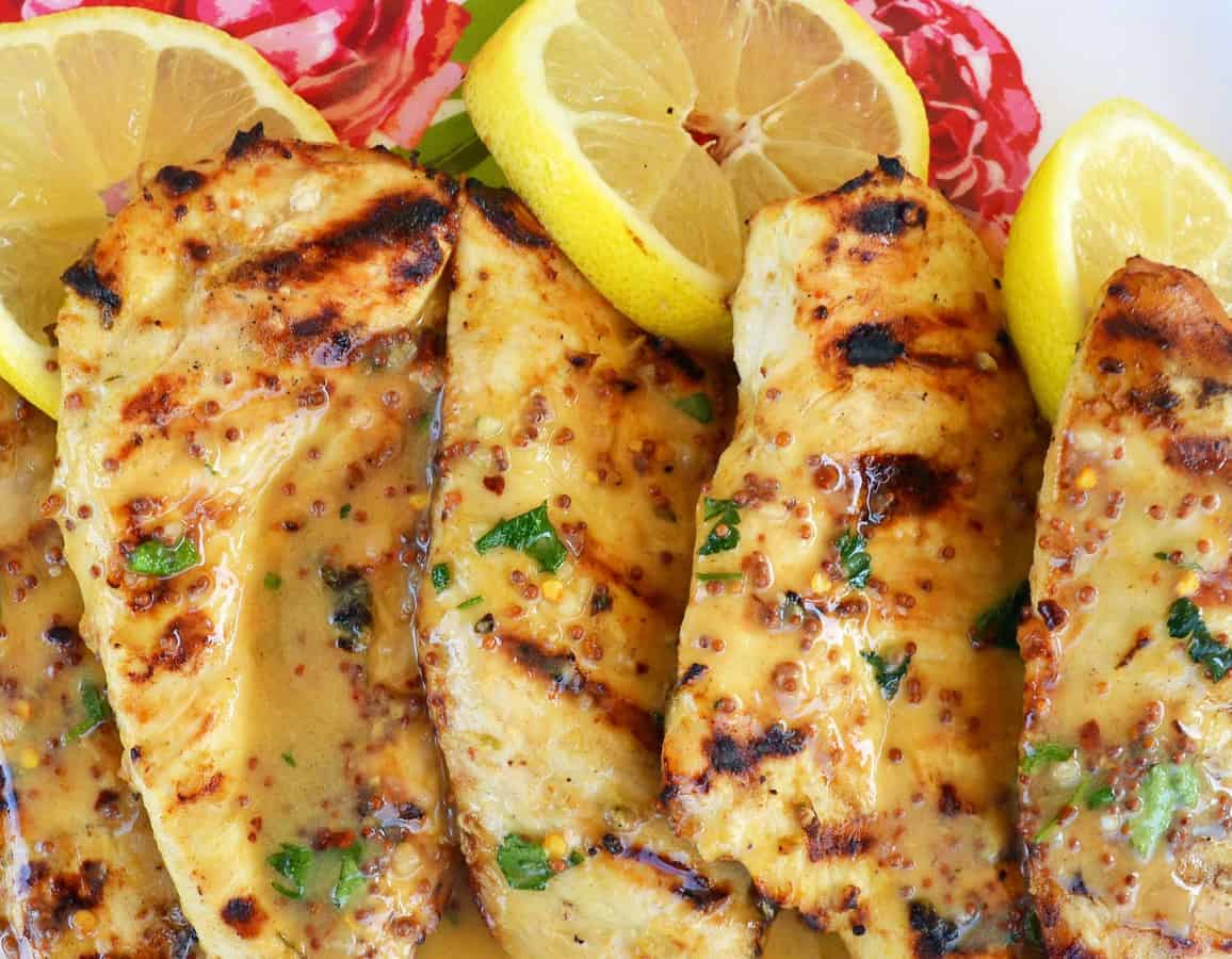 There’s nothing better on a warm Spring or Summer day than firing up the grill and eating perfectly grilled Lemon Honey Dijon Grilled Chicken.
