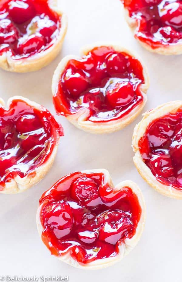 These Mini Cherry Pies are super simple to make and you only need three ingredients. To make these Mini Cherry Pies you will need refrigerated pie crust dough, cherry pie filling and whipped topping. Bake for 30 minutes and you will have the perfect summer party dessert.