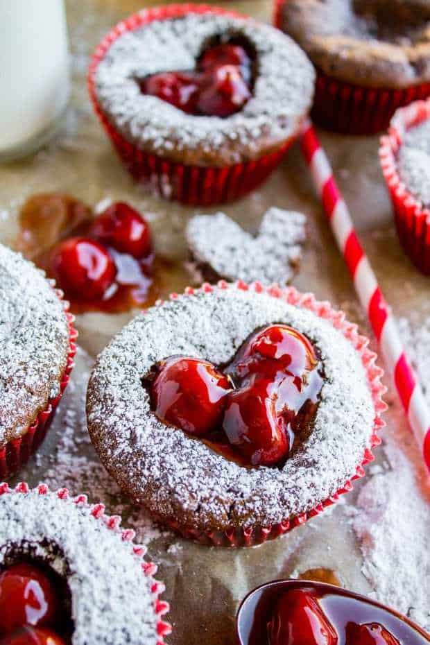 Picture this: a decadently moist chocolate cupcake. No dry center for sure, because you have a CHEESECAKE center. And THEN, you cut a heart out of the top and spoon in cherry pie filling. Dry cupcakes, be gone! These are just perfect for Valentine's Day! Everyone will love you.