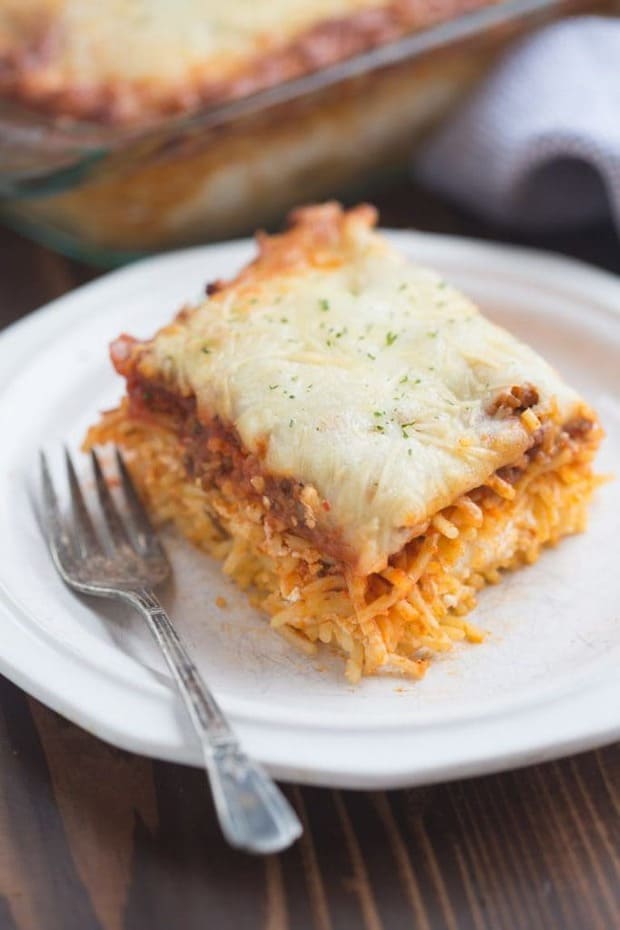 Million Dollar Spaghetti is a DELICIOUS easy dinner idea! The noodles are layered with a cheesy center and topped with a yummy homemade meat sauce and cheese.