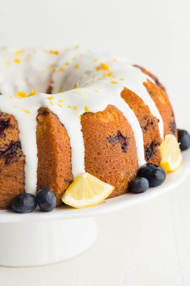 Lemon Blueberry Bundt Cake made completely from scratch has taken the classic lemon bundt cake and speckled it with fresh blueberries then topped the whole cake off with lemon cream cheese glaze. Perfect for spring get-togethers.