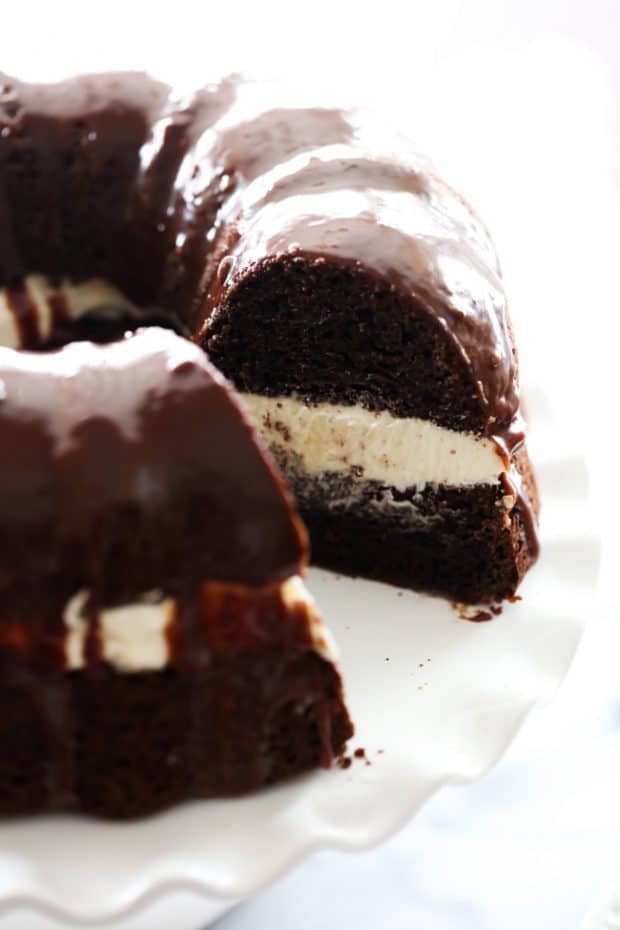 Ding Dong Bundt Cake is unbelievably amazing! The chocolate cake is extremely moist and the cream filling is completely made from scratch and tastes incredible. It is topped with a rich chocolate ganache. This cake will become a new staple.