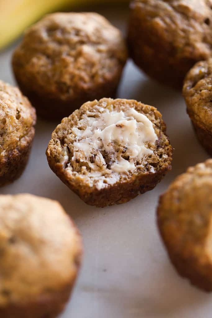 SKINNY BANANA BREAD MUFFINS that are so flavorful and moist you would never know they are healthy (er).  These banana muffins have no oil, are low sugar, and just over 100 calories each