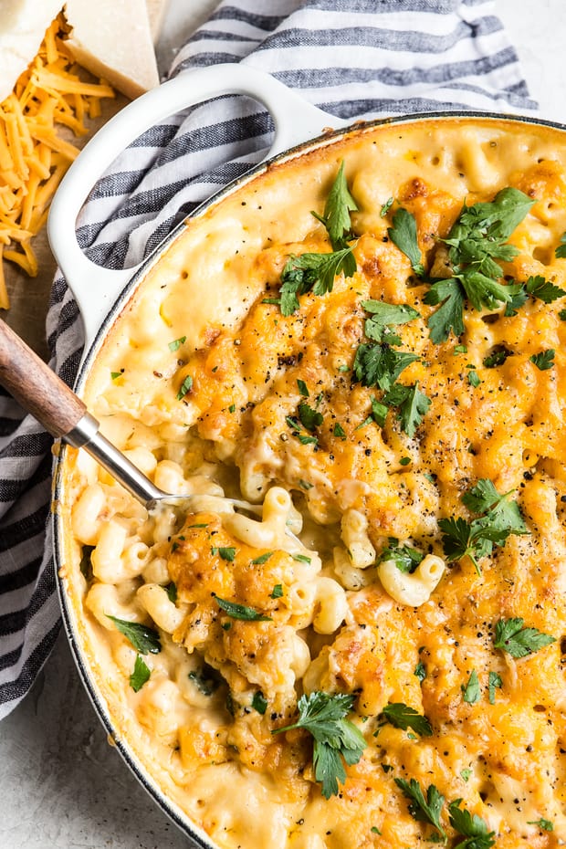 Baked Macaroni and Cheese comes together quick and easy. Homemade cheese sauce generously covers noodles and is baked to a rich, bubbly, golden brown perfection. When served with a hearty side of veggies, this indulgent dish becomes the perfect weeknight meal.