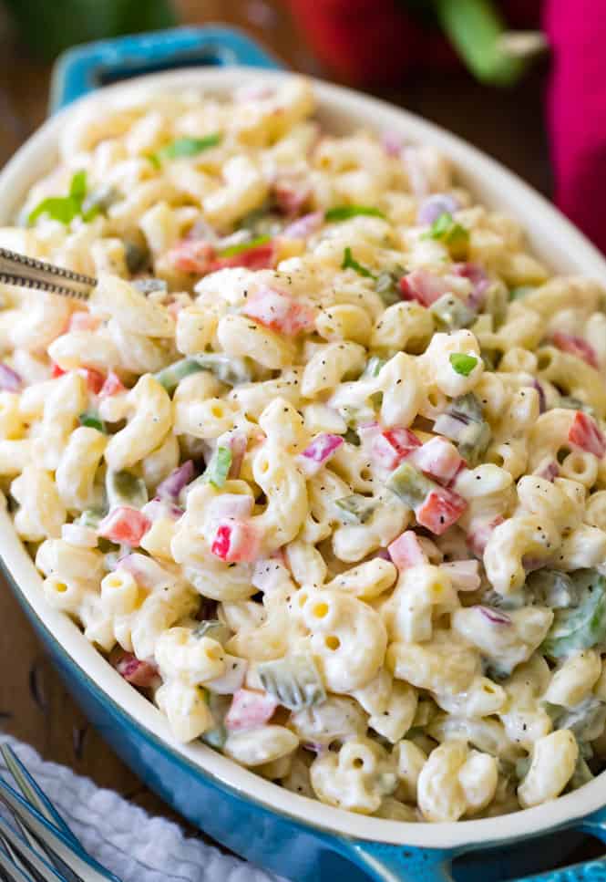 This is a classic, tasty, and oh-so easy macaroni salad recipe! Made with classic ingredient staples including celery, red pepper, and onion and dressed up in a simple creamy mayo-based dressing, this is guaranteed to be a hit at every cookout and potluck this year!