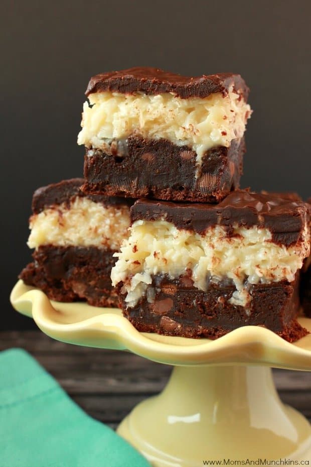 These Chocolate Coconut Brownies from Moms and Munchkins may look complicated, but they are super easy to make! The best fudge brownies are topped with a chewy coconut middle and chocolate ganache