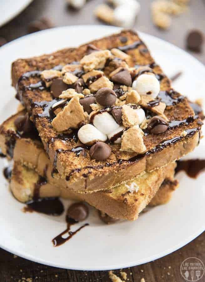 S'mores French Toast is a delicious twist on traditional french toast with a graham cracker crust, topped in toasted marshmallows, chocolate chips and chocolate syrup!