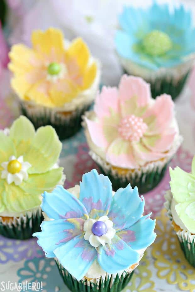 Looking for a cute spring dessert? These Easy Chocolate Flower Cupcakes are simple, fun, and perfect for birthdays and showers! They feature a delicious lemon cupcake, fluffy coconut frosting, and simple, beautiful chocolate flowers on top.