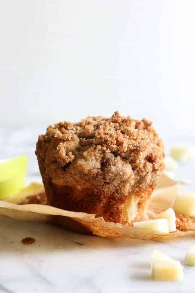 Apple Crumb Muffins.  Light and fluffy bakery style muffins loaded up with bits of fresh apple and spiced with a hint of cinnamon.  All topped off with a delicate brown sugar crumble.