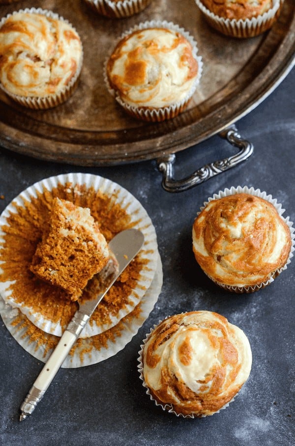Pumpkin Cream Cheese Swirl Muffins: moist spiced pumpkin muffins are topped with sweet cream cheese that melts into them as they bake and only take 30 minutes!