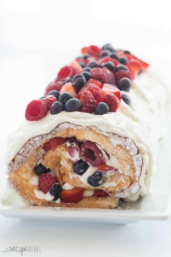This Triple Berry Angel Food Cake Roll is an easy red, white and blue dessert (or just red and white!) for the 4th of July or Canada Day, or any day! Perfect with fresh summer strawberries, raspberries and blueberries