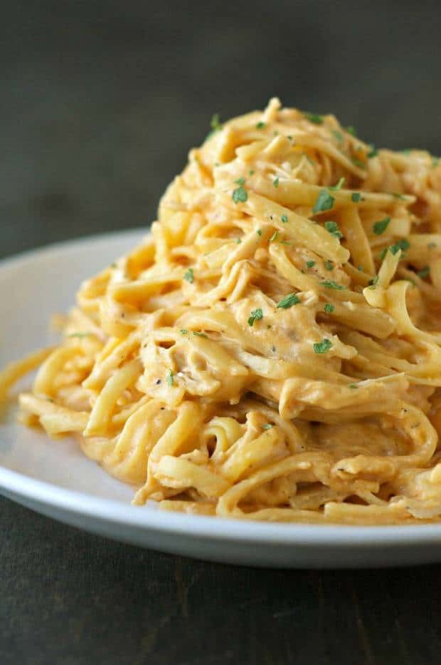 Delicious, rich, cheesy, creamy and just the right amount of spicy…. Cheesy Buffalo Chicken Pasta.  In the slow cooker.  Like every step of this recipe completed in the slow cooker.  Have I convinced you yet?