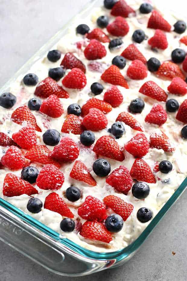No Bake Berry Icebox Cake – An easy no bake dessert that’s cool, creamy, and perfect for those hot Summer months!  This icebox cake has layers of fresh berries, creamy filling, and vanilla wafers make for the most refreshing dessert!