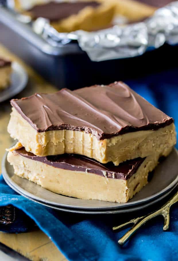 Easy, creamy, no-bake peanut butter bars!  With just a handful of simple ingredients that you already probably have on hand, these peanut butter bars take only a matter of minutes to make and are a classic combination of peanut butter and chocolate!  Be sure to check out the quick how-to video just before the recipe!