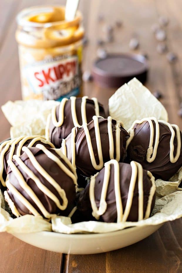 These peanut butter brownie bombs are perfect for all occasions! Rich brownies filled with peanut butter and covered with chocolate and peanut butter icing.