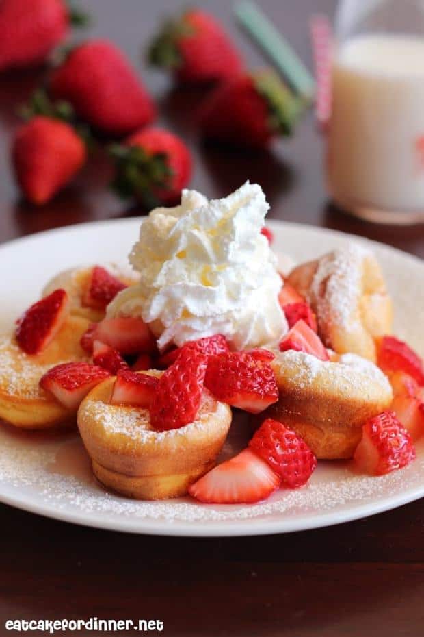 The mini pancakes themselves are not sweet at all and if you taste them plain, you might not like them so much.  BUT . . . when you top them with sugary sweet and juicy strawberries, powdered sugar and fresh whipped cream . . . THEY ARE SO YUMMY.