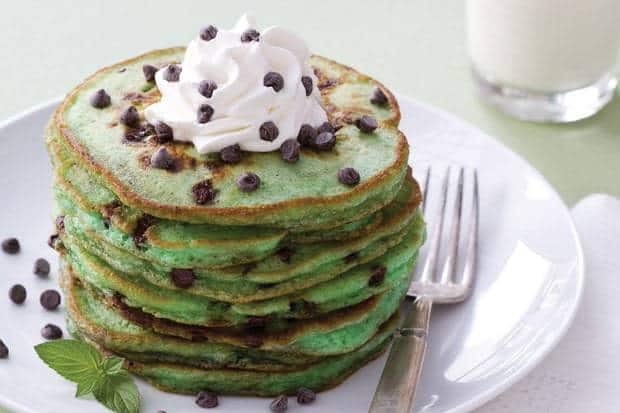 There's nothing as delightful as a towering stack of fluffy pancakes. Unless those pancakes happen to be reminiscent of your favorite mint chocolate chip ice cream. The green food coloring here is optional but adds nicely to the appeal.