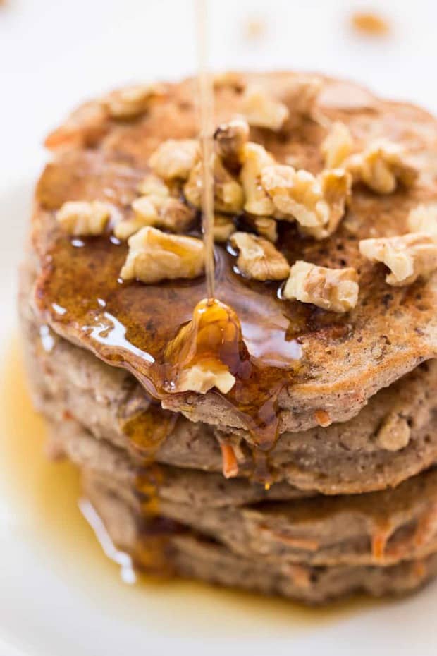 These healthy carrot cake pancakes are packed with nutritious ingredients like quinoa, almond, flax and coconut! The perfect way to kickstart your day with a breakfast that tastes like dessert!