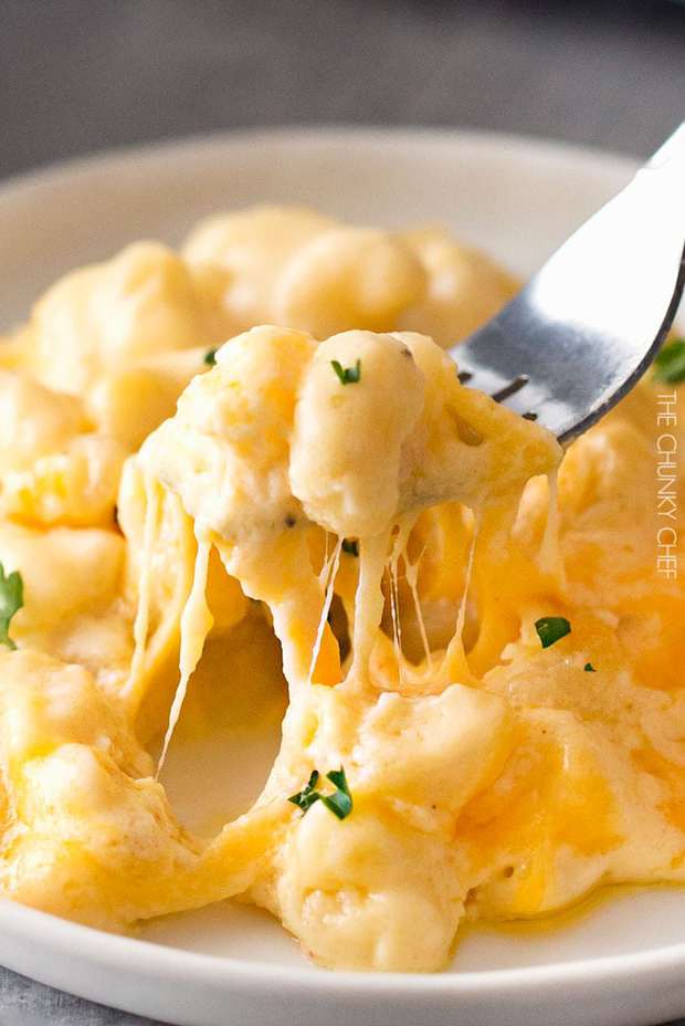 Everyone has their favorite baked mac and cheese recipe… and this is mine.  It uses a combination of cheeses, layered in the dish as well as melted into a rich and creamy cheese sauce, for the ultimate in cheesy deliciousness!