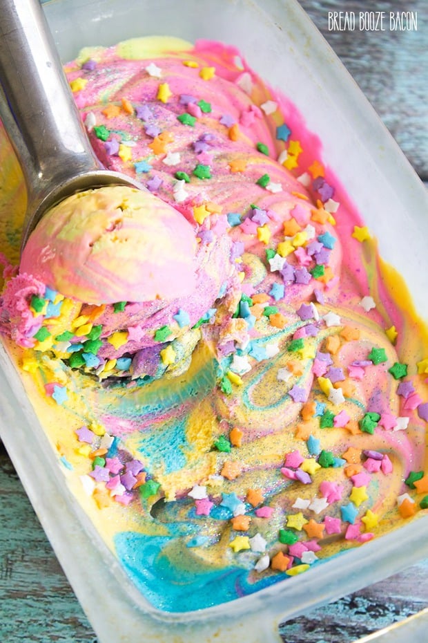 Unicorn Ice Cream is magic on a cone! There’s nothing better on a hot day than rainbow ice cream that’s covered in star sprinkles and glitter!