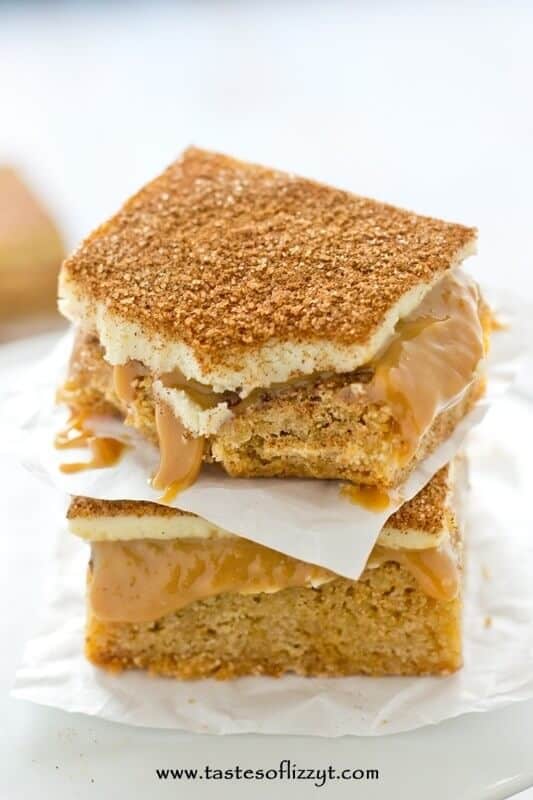Three-layer Snickerdoodle Caramel Bars will have you head over heels! Soft, cinnamon blondies covered in smooth dulce de leche and topped with sweet white chocolate. You won’t believe how good these are!