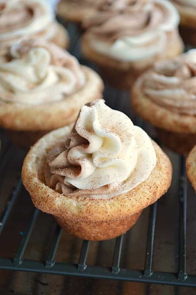 oft and fluffy Snickerdoodle Cookie cups filled with sweet cinnamon and vanilla swirled frosting.