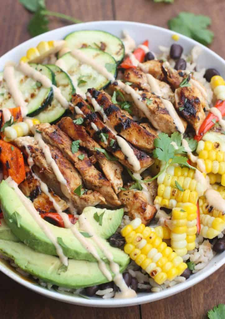 BBQ Ranch Grilled Chicken and Veggie Bowls served over black bean rice with delicious grilled veggies, marinated and grilled chicken, and a delicious Hidden Valley® Honey BBQ Ranch® Dressing. 