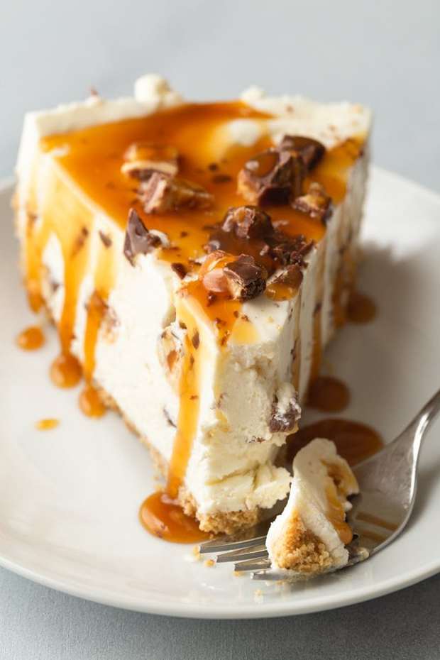 Decadent and silky No-Bake Snickers Cheesecake will satisfy all your dessert cravings. The creamy cheesecake filling is speckled with chopped Snickers candy bars and sits over a buttery graham cracker crust.