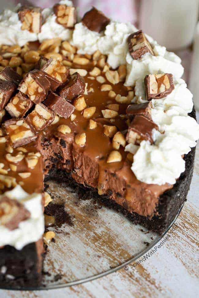 This amazing no bake Nutella Snickers Pie is loaded with chocolate, caramel & peanuts!  Not only is it quick to make, it is a huge hit at any gathering!  Rich, creamy and oh so yummy, this pie is one perfect bite.