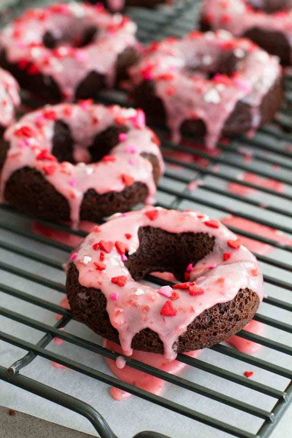 An easy recipe for Baked Chocolate Donuts with an easy Cherry Glaze. Perfect for breakfast, dessert, or a special holiday treat.