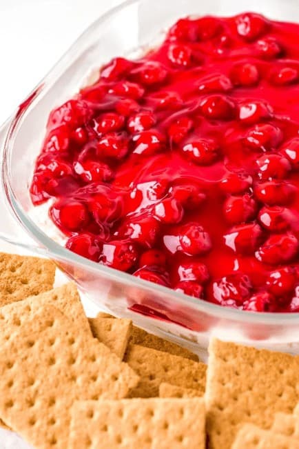 Have the taste of classic cherry cheesecake to your party without all the trouble thanks to this easy four-ingredient cherry cheesecake dip. Perfect to make in advance and easy to customize with different cookies or crackers.