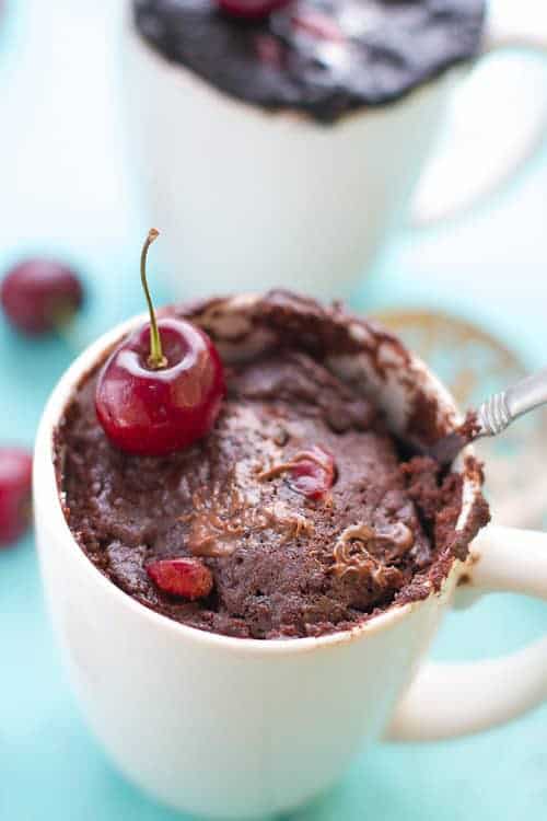 Moist and easy chocolate mug cake is vegan made with fresh cherries, chocolate almond milk, salted caramel and NO eggs. Cooks up in just over a minute and perfect for those late night chocolate cravings.