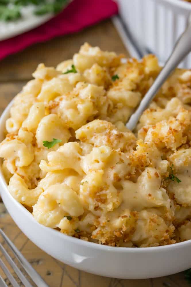 A classic and easy baked mac and cheese recipe!  This recipe is dangerously easy to make and is topped off with a buttery, crisp toasted panko topping!  If you have a cast iron or oven-safe pan handy, you can even bake it in the same pan that you use to make the sauce!