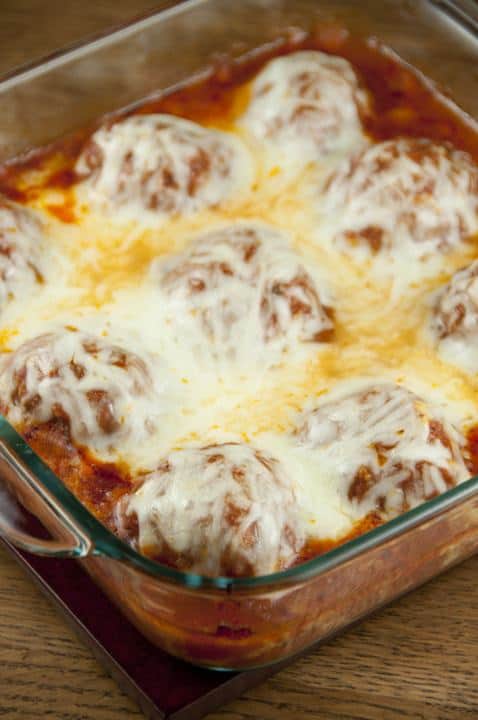 Cheesy meatballs with tomato sauce baked right in the oven – no mess or frying! Good enough for a fancy dinner to serve for a holiday or to dinner guests.