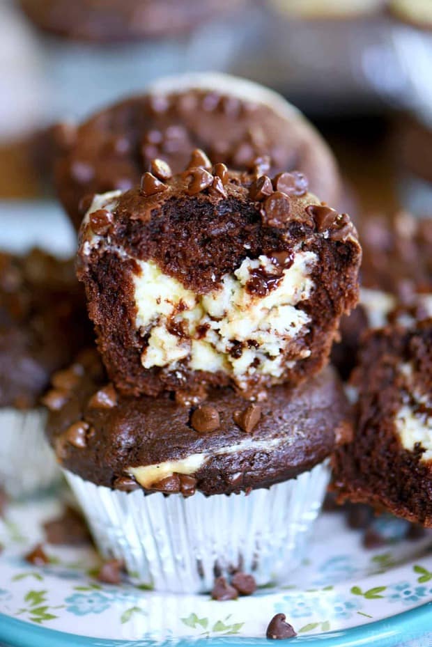 Treat your family to Cheesecake Chocolate Chip Muffins this weekend and make breakfast an event they won’t soon forget. Decadent chocolate chip muffins stuffed with a creamy cheesecake filling are a chocolate lover’s dream come true!