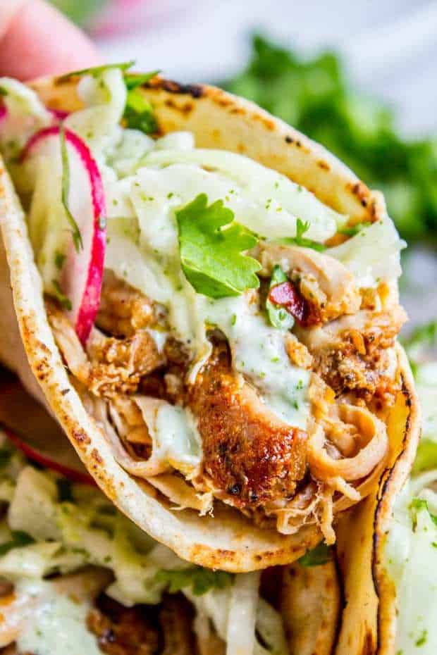 The juiciest Slow Cooker Pork Tacos! No marinating, just make a simple spice rub and toss it in the crock pot. So easy. Then top it off with a homemade Mexican coleslaw that you are going to LOVE!