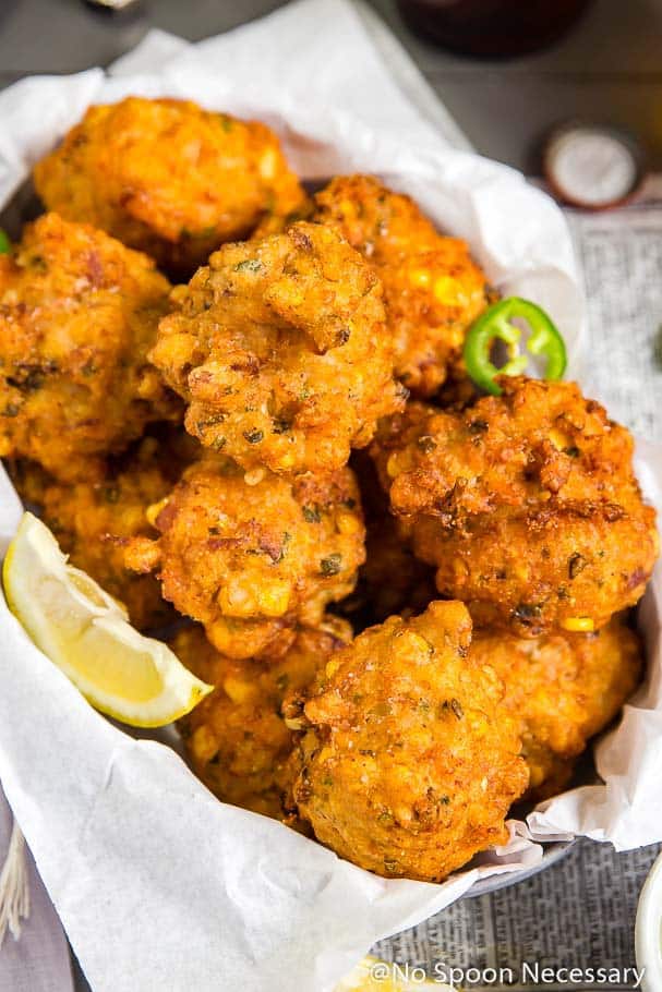 These Lobster & Bacon Corn Fritters are fluffy on the inside, crispy on the outside and filled with real lobster meat, salty bits of bacon and kernels of corn. Served with a Jalapeno-Honey Aioli, these fritters are fantastic!!