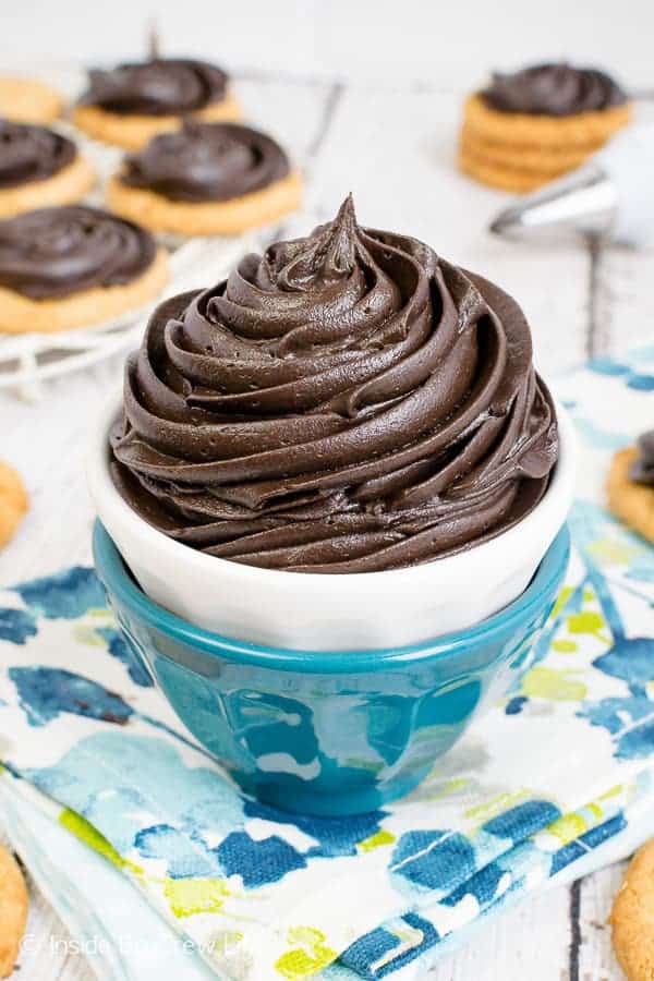 This rich and smooth Dark Chocolate Buttercream Frosting will satisfy any chocolate lover. It’s the perfect topping for for cakes, cupcakes, and cookies. You will never buy store bought chocolate frosting after trying this homemade frosting recipe.