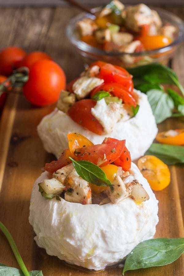 Easy Stuffed Fresh Mozzarella Caprese, the italian dish that screams summer, fresh mozzarella, tomatoes and herbs make this the perfect side dish, appetizer or even main course. You are going to love it.