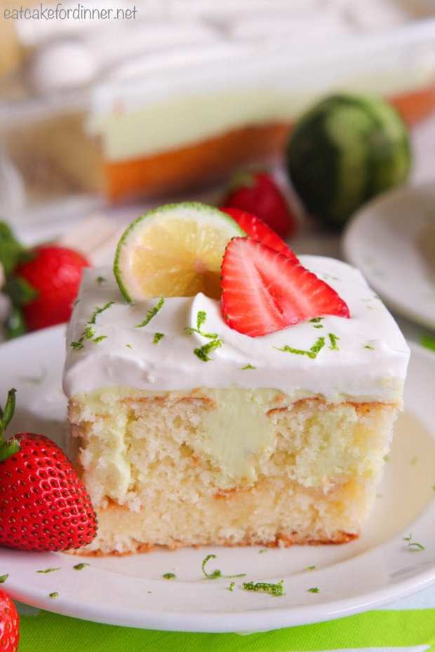 Key Lime Poke Cake is a delicious white cake that is seeping with a sweet and tart mixture that soaks into the holes.  Topped with fresh whipping cream and strawberries this makes a delicious dessert!